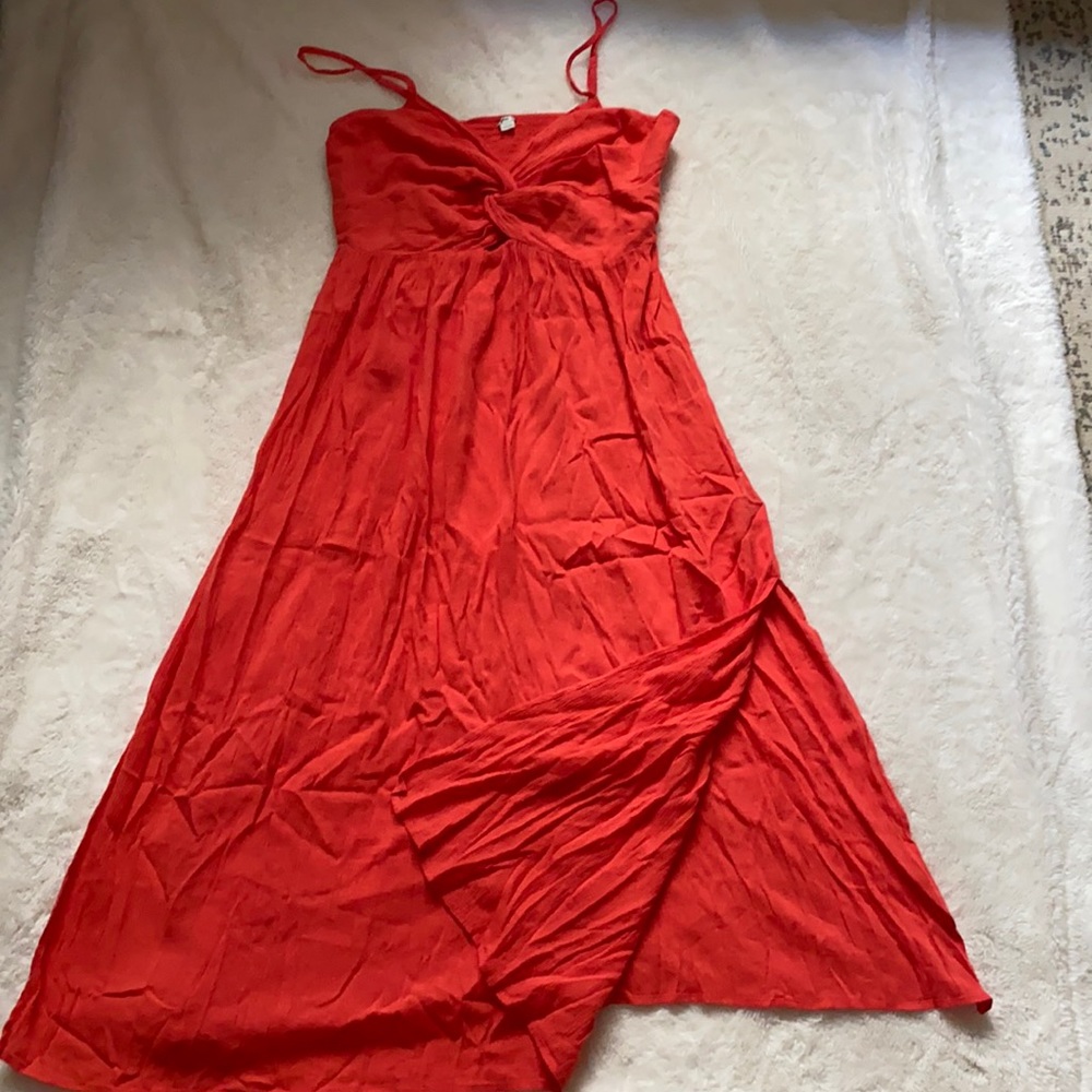Beautiful vibrant summer dress with a slit.